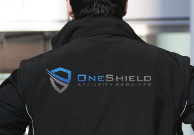 One Shield officer at a building entrance